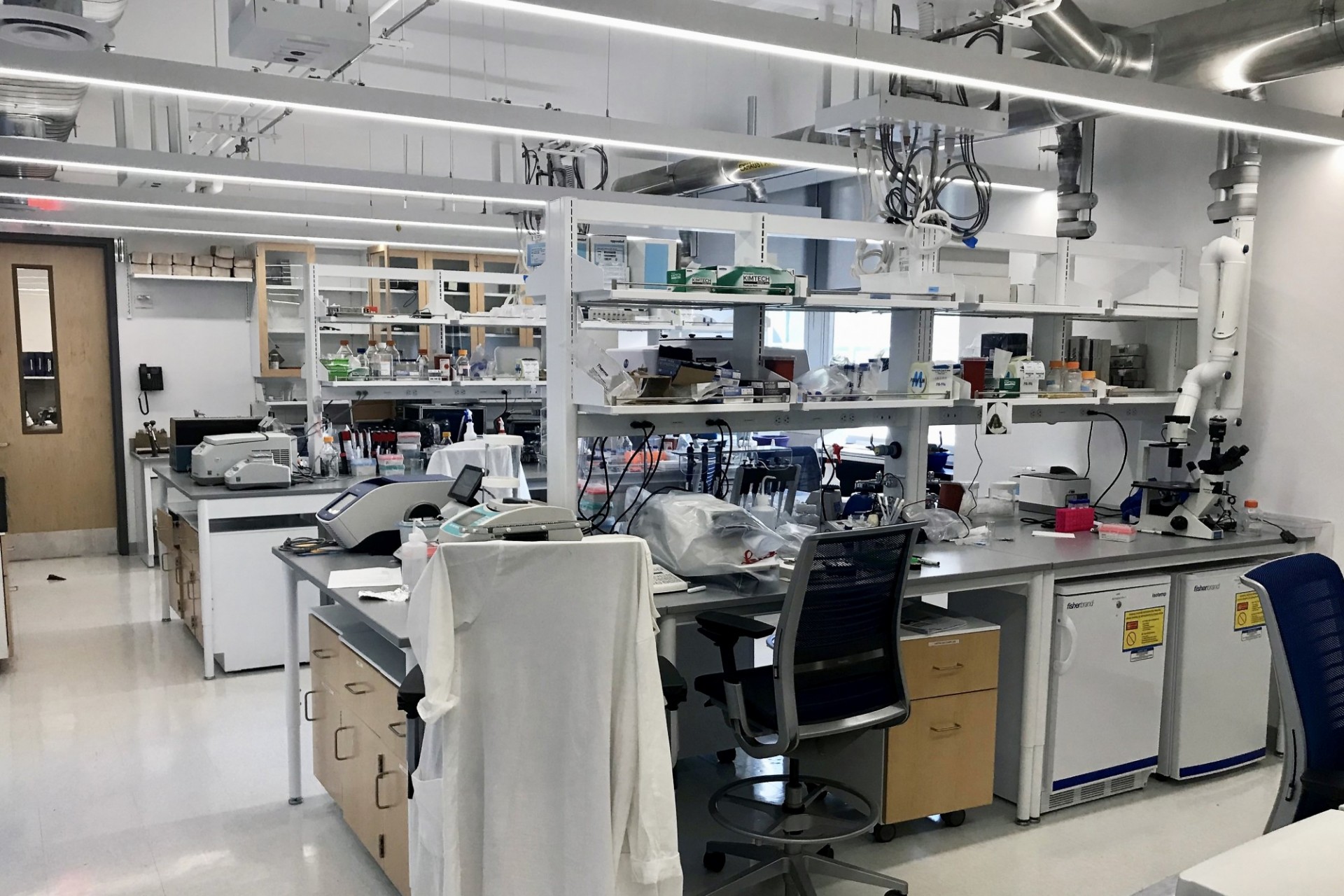 A refreshed lab with white finishes, full of equipment.