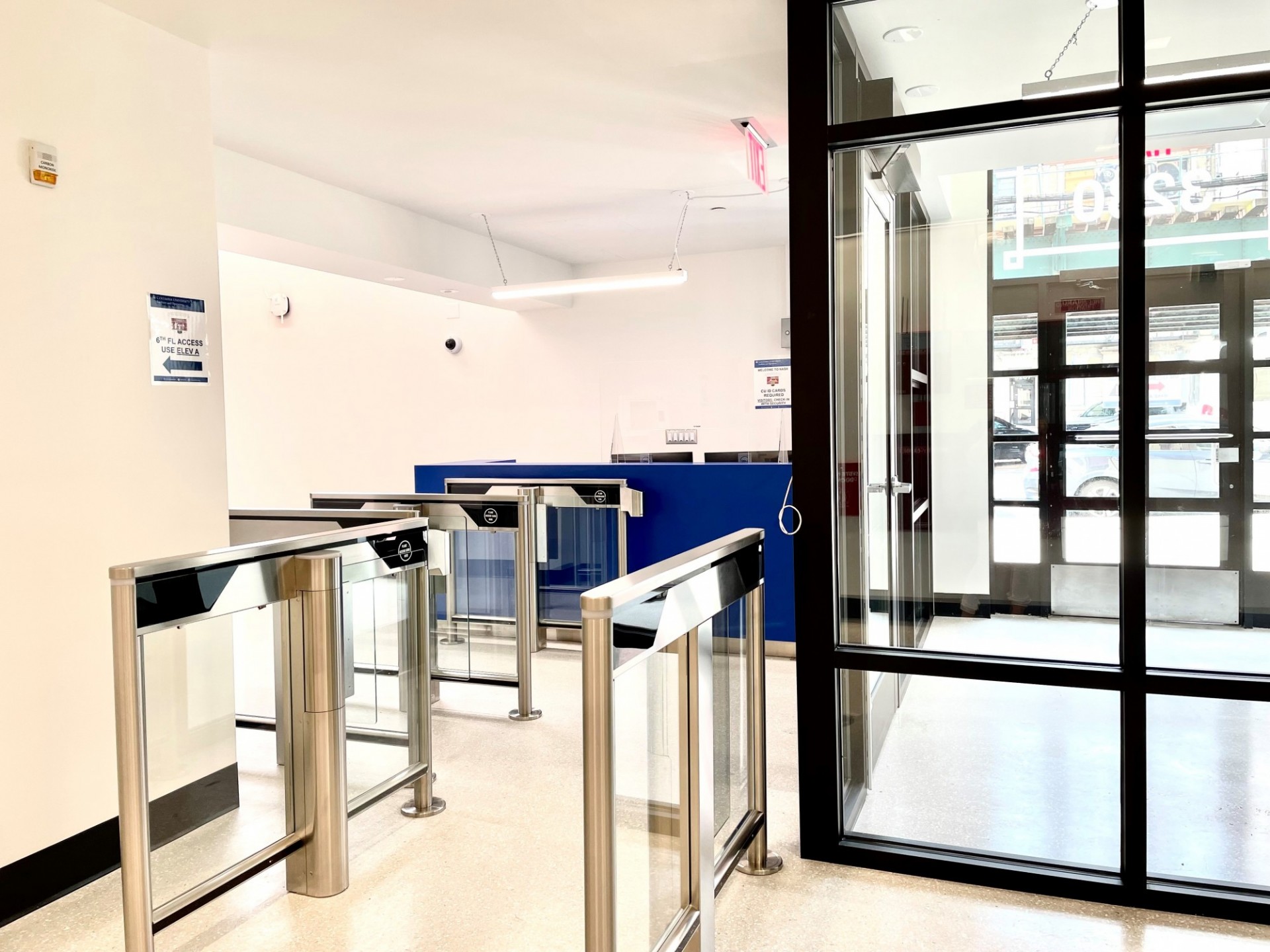 A view of the renovated lobby within the Nash Building, which new turnstiles and blue security desk.