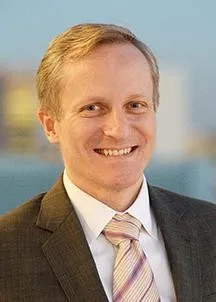 A headshot of David M. Greenberg